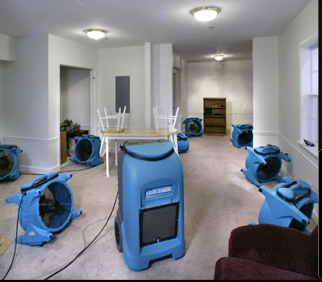 Air movers and dehumidifier setup for Water Damage Restoration in Stockbridge